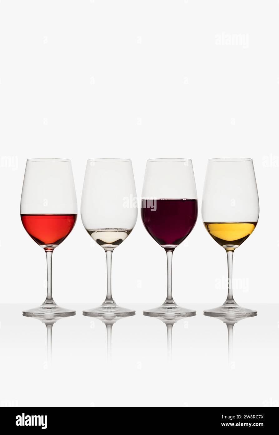 Glasses of red, white and rose wine on white background Stock Photo