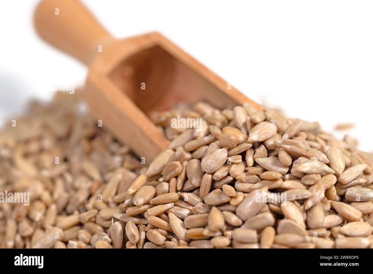 Peeled sunflower seeds against a white background Stock Photo