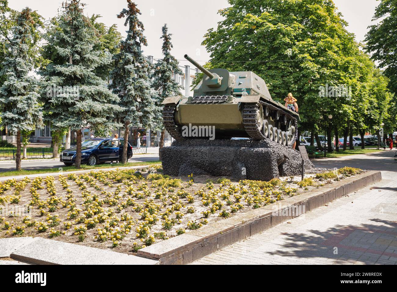 Sarny, Ukraine - June 30, 2023: People visit Soviet SU-76 in park in the city center. Sarny is a small city in Rivne region, western Ukraine. It is a Stock Photo