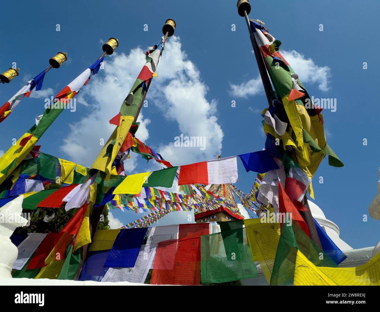 Buddhist prayer flags fly at Bodhanath Stupa - Kathmandu, Nepal Stock Photo