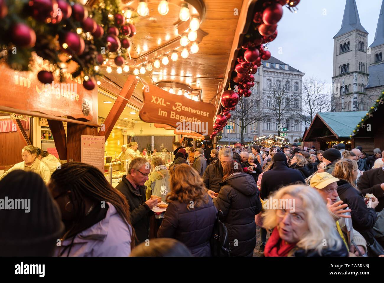 Bonn, Germany - December 16, 2023 : People enjoying beverages and food at the beautiful Christmas Market in Bonn Germany Stock Photo