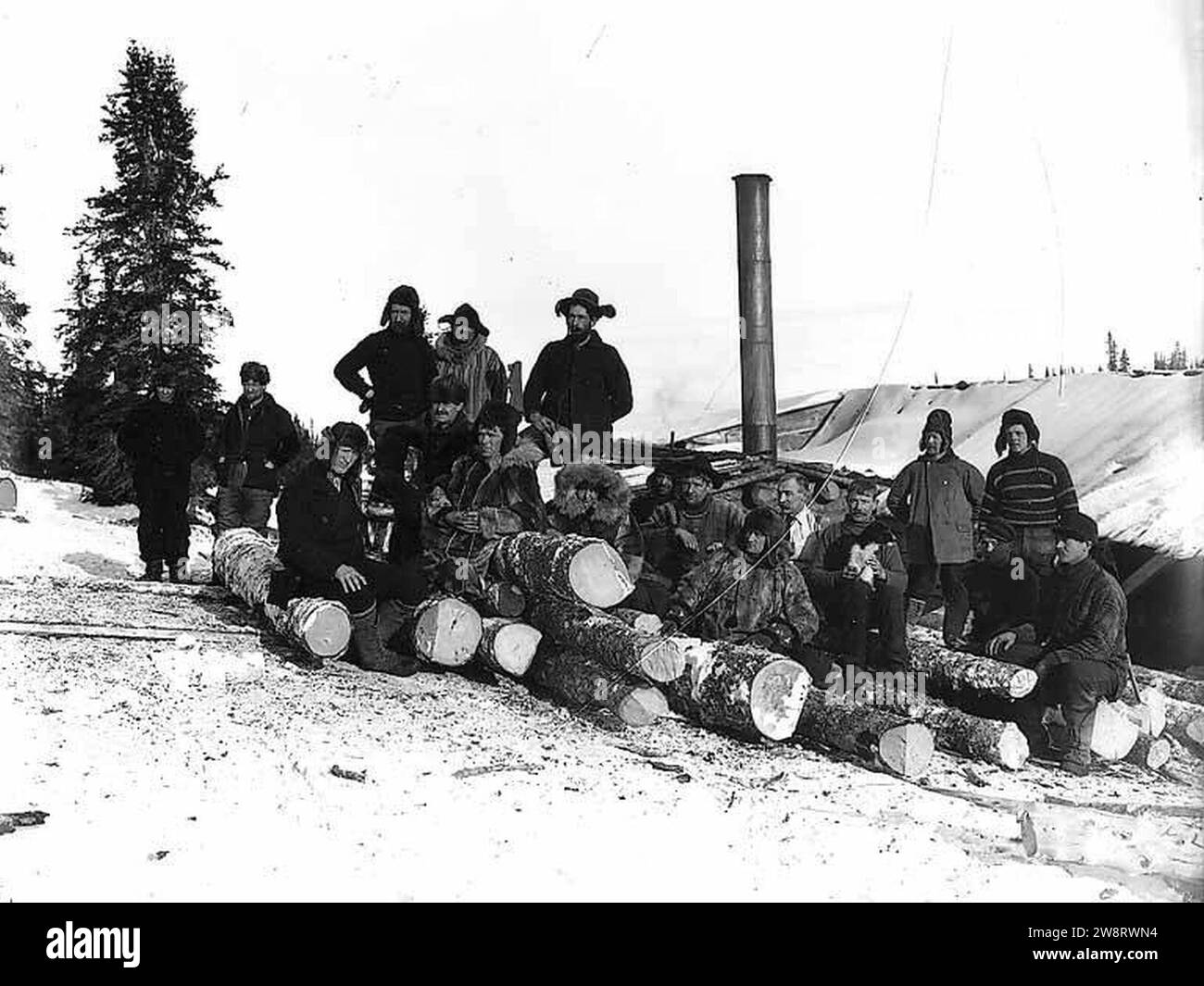 Workers and lumber probably from the Wild Goose Mining and Trading Company's mill on Duncan Creek, Alaska, circa 1905 (AL CA 150). Stock Photo