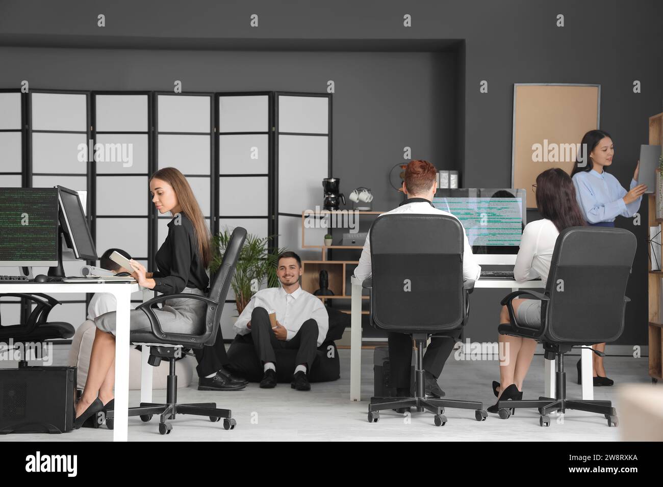 Team of young programmers working in office Stock Photo