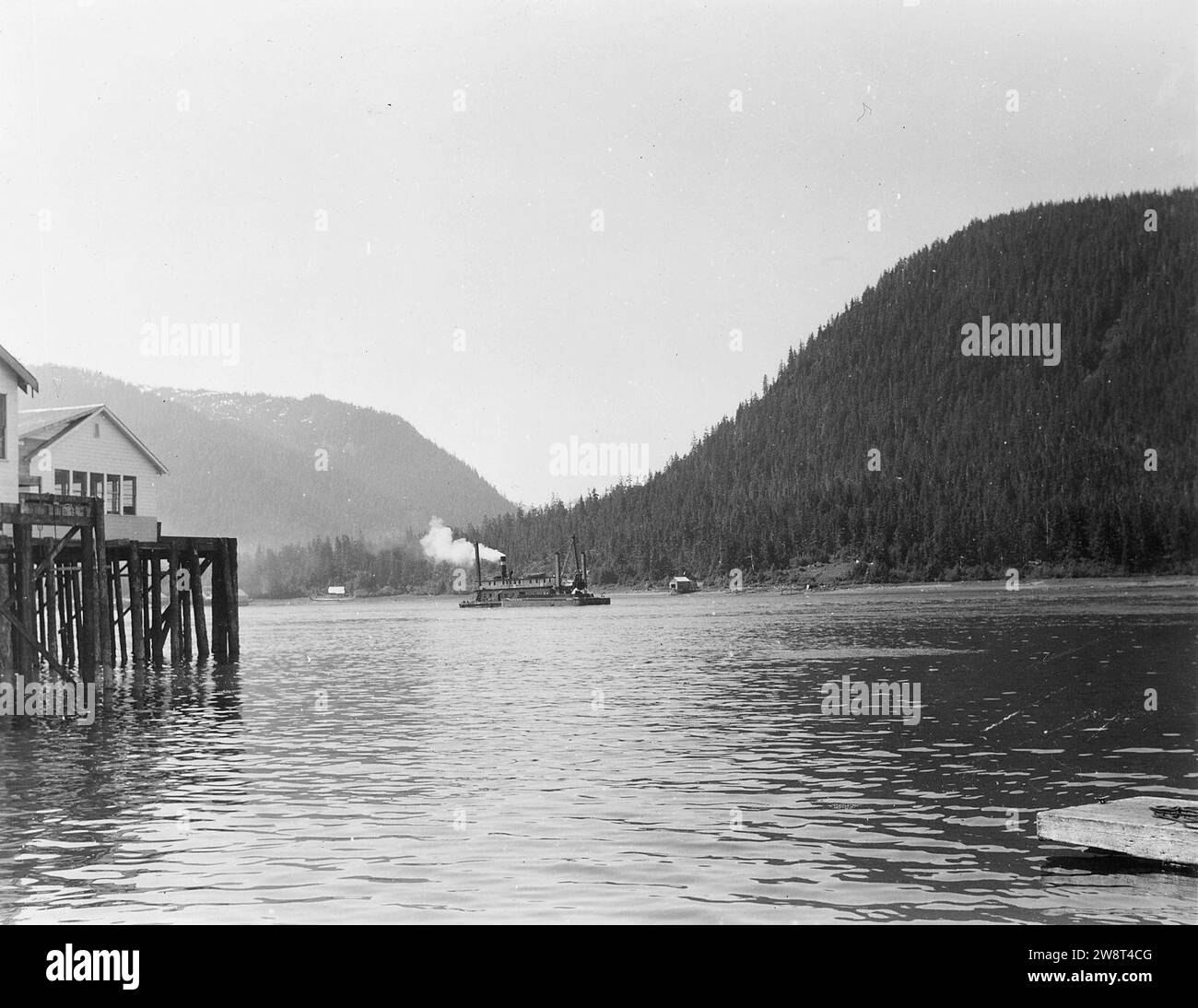 Wrangell Narrows, Alaska. Bringing dump scow in position to load. 11 June 1948 Stock Photo Alamy