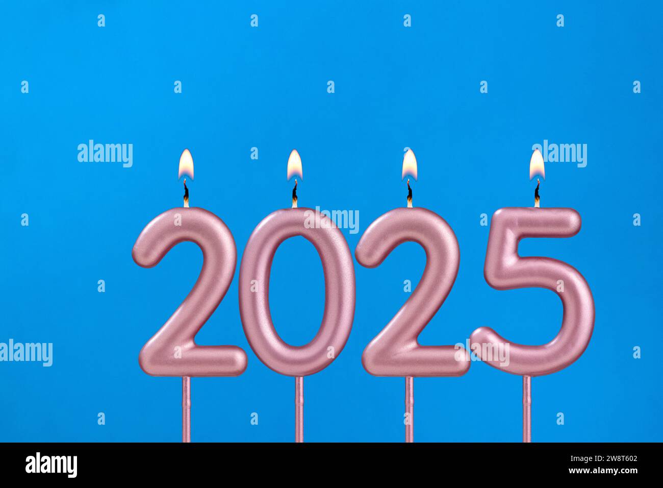 Happy new year 2025 candles Cupcake on blue background with balloons
