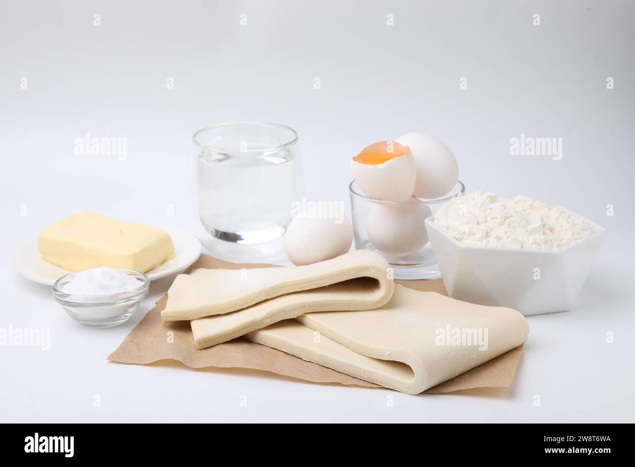 Raw puff pastry dough and ingredients isolated on white Stock Photo - Alamy