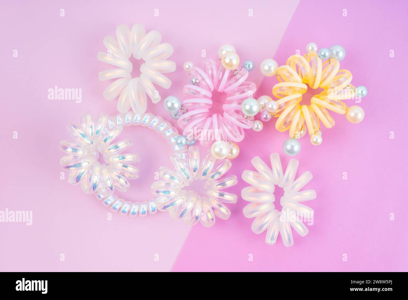 Colorful plastic hair elastics set on beautiful background Stock Photo