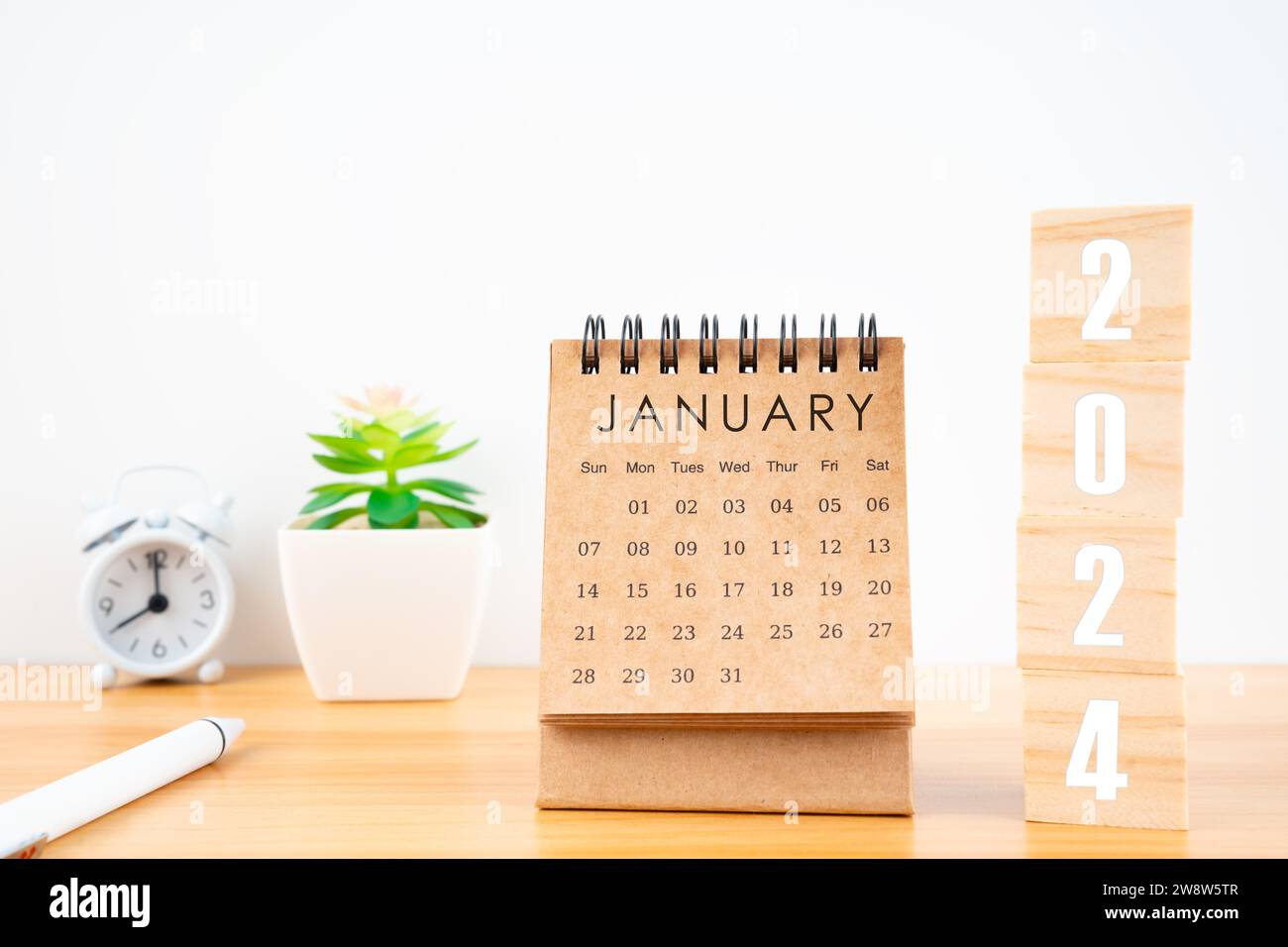 January 2024 desk calendar with wooden cubes show 2024 number on ...