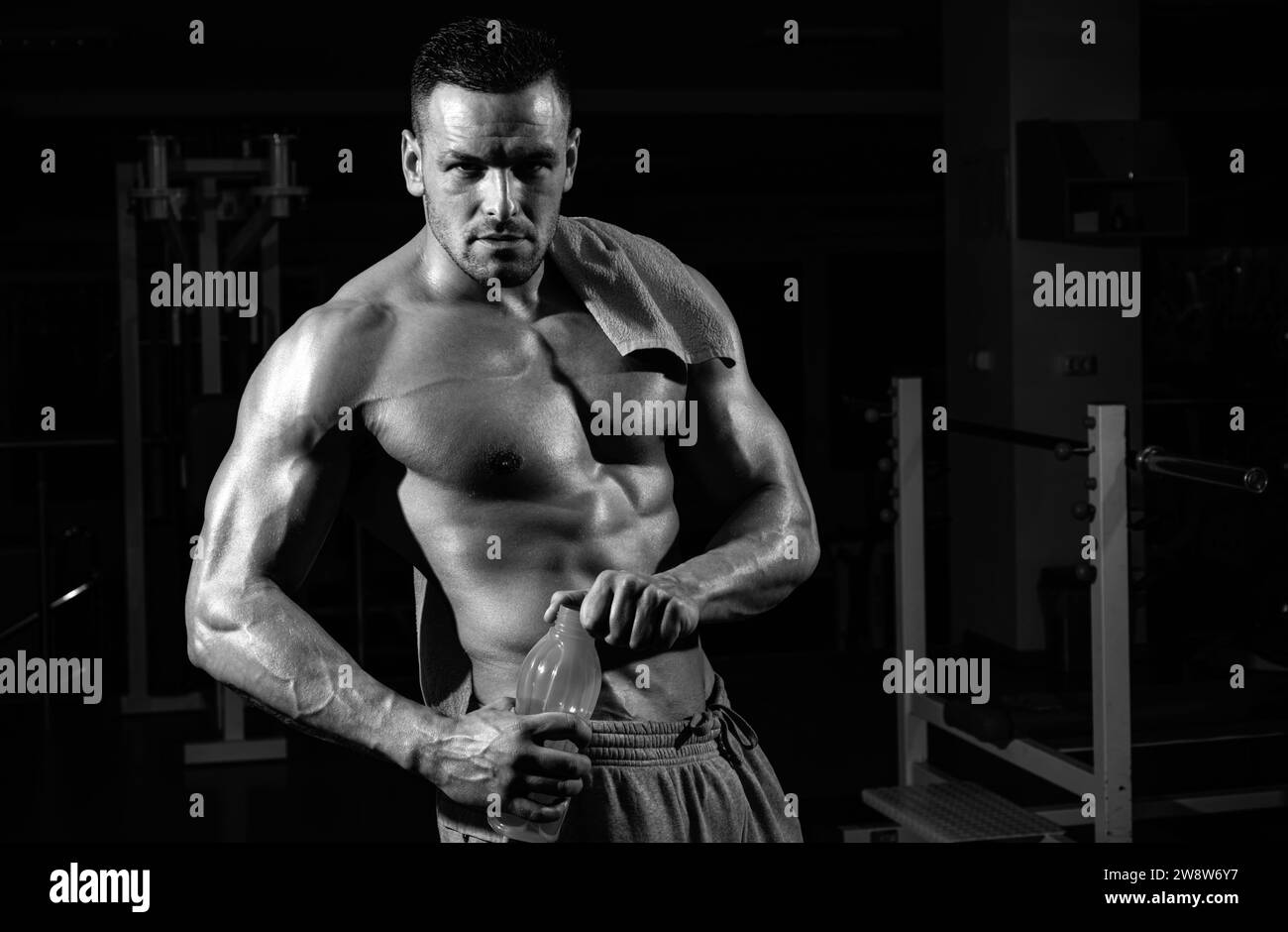 Stay hydrated concept. Weightlifter gym man preparing for training