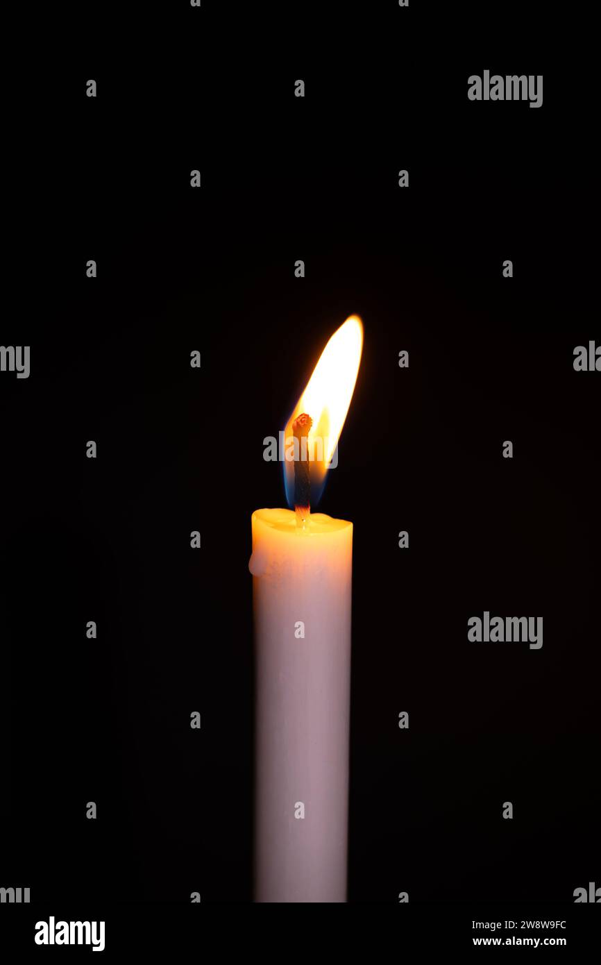 Burning White Candle on the dark, flame of candle on black background ...