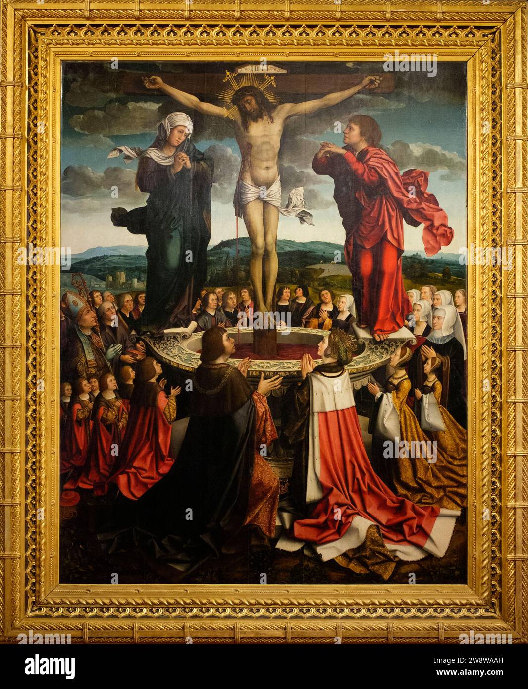 Portugal: Fons Vitae (Fountain of Life) c.1515-17, painting by Colijn de Coter (c. 1440 - c. 1532), oil on oak wood and originating in Flanders, now in the Museu da Misericórdia do Porto, Porto.  At the centre left, kneeling, is King Manuel I of Portugal. To the centre right is Maria of Aragon, followed by Isabella of Portugal and Beatrice of Portugal, the Duchess of Savoy. Stock Photo