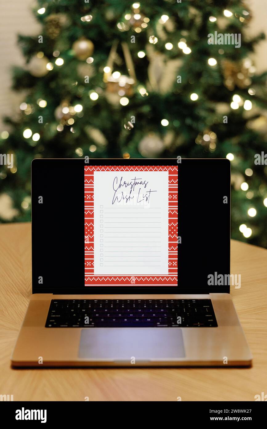 Digital christmas wish list on laptop Stock Photo