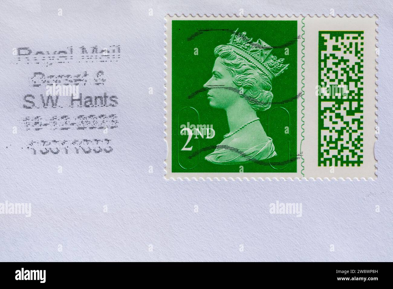 green 2nd class stamp with Queen Elizabeth II head, stuck on envelope