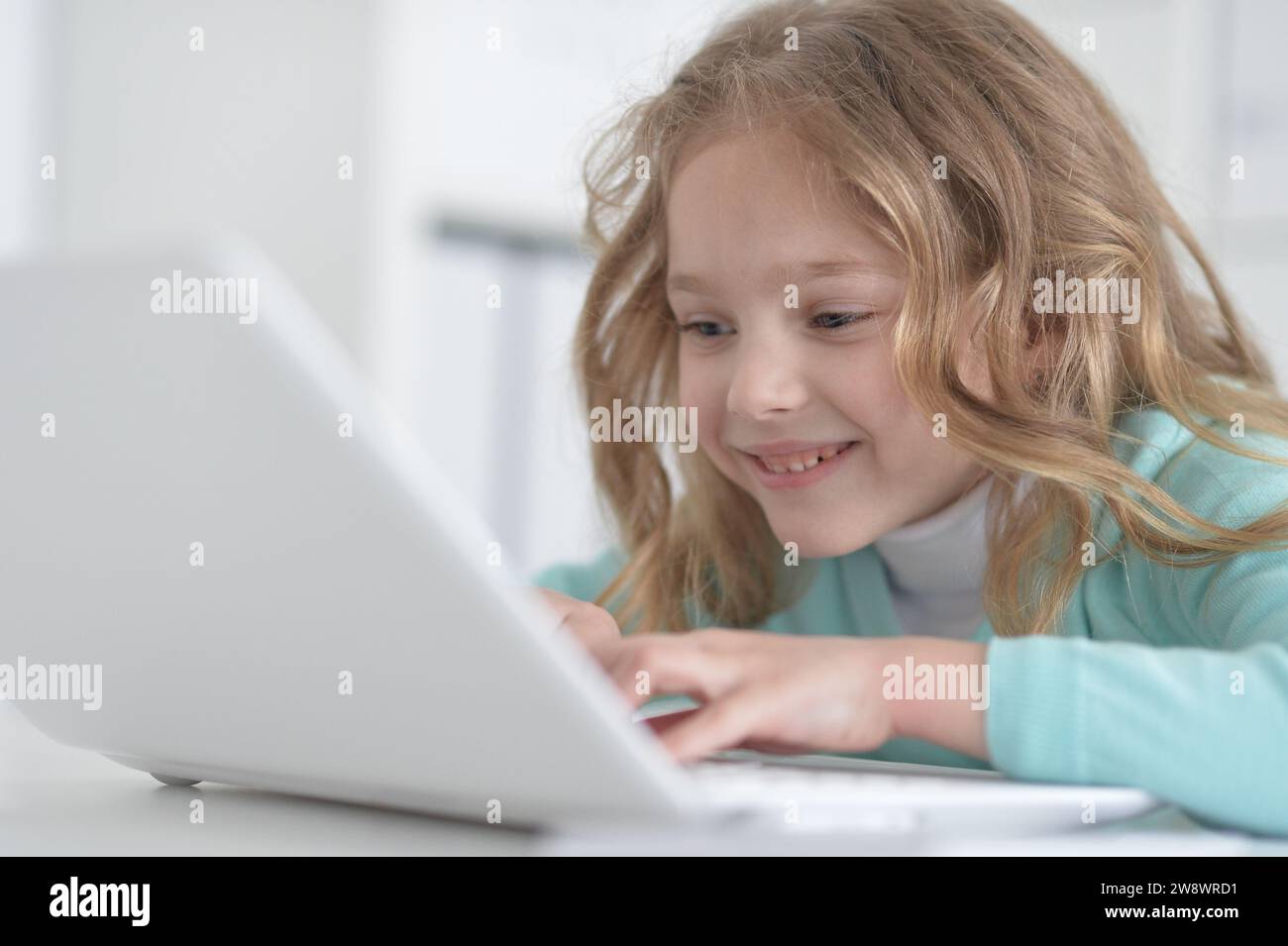 Cute and happy little girl children using laptop computer Stock Photo ...