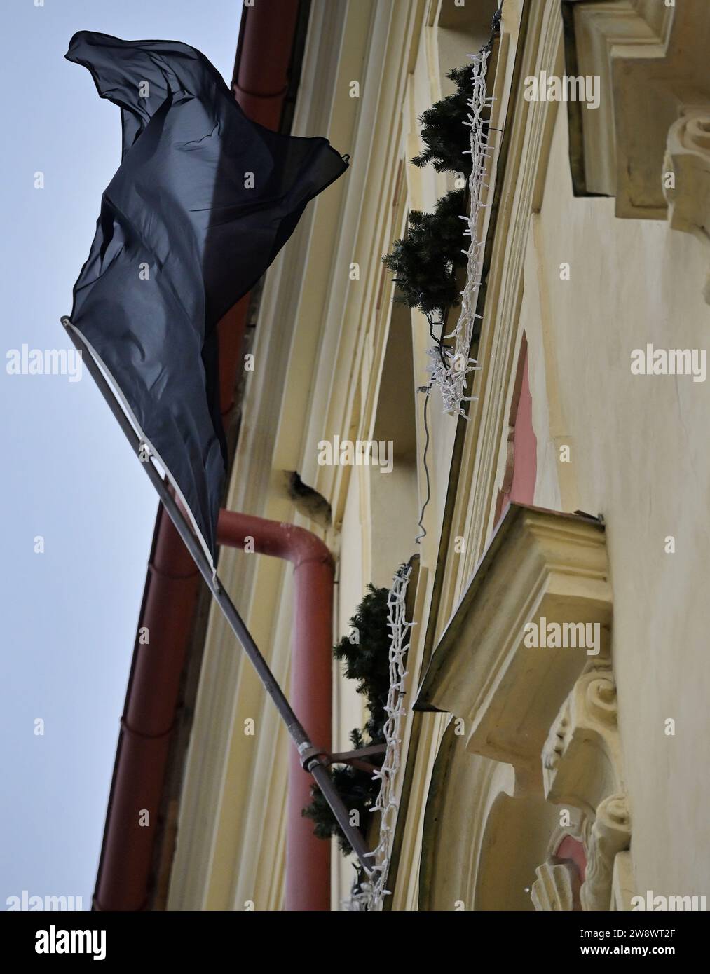 Jihlava, Czech Republic. 22nd Dec, 2023. A black flag flies at the City