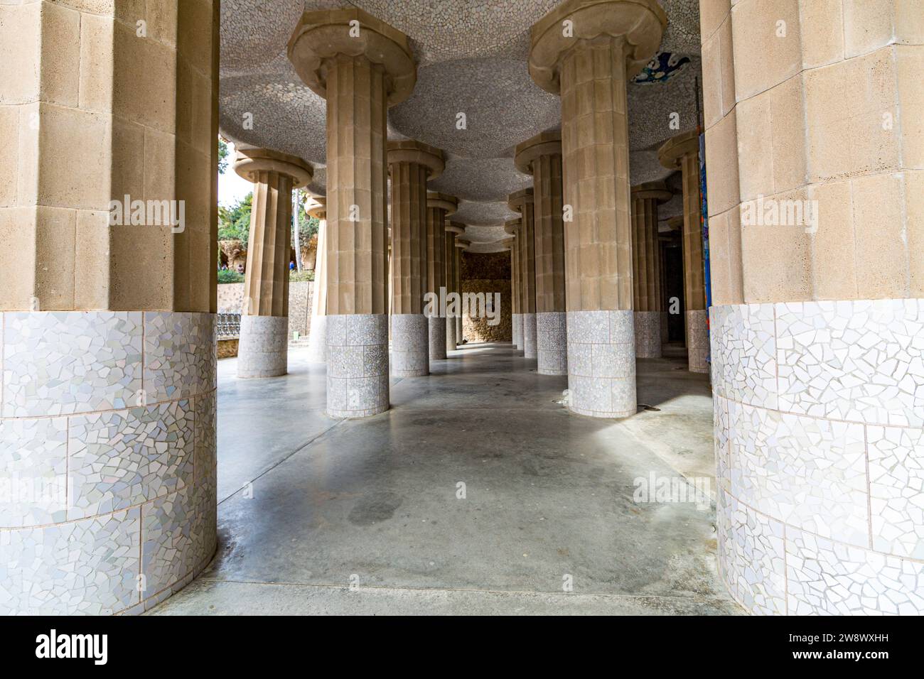 Front perspective of hall with columns with fragments of tiles and ...