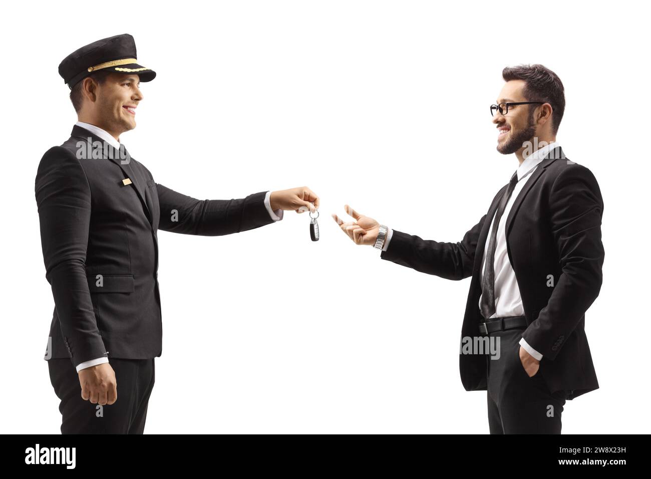 Chauffeur giving car keys to a gentleman isolated on white background Stock Photo
