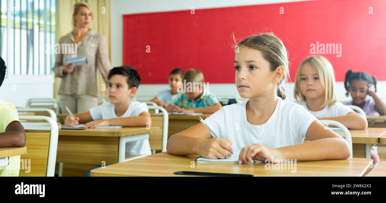 School girl working at lesson in classroom Stock Photo - Alamy