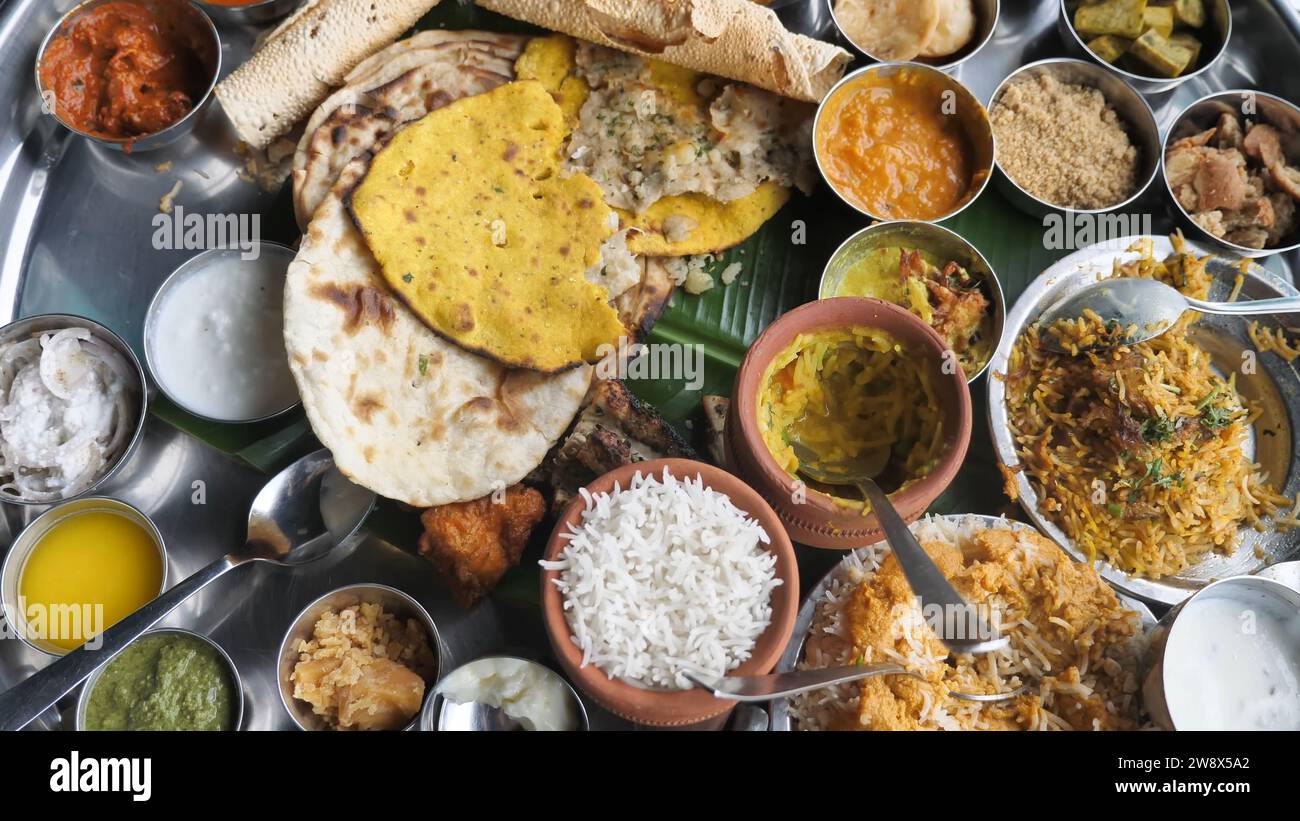 The Curry Heaven 38 Items Thali Indian Restaurant Food - Mumbai Biggest Thali - Best Indian Street Food in Mumbai, Maharashtra India - Indian cuisine. Stock Photo