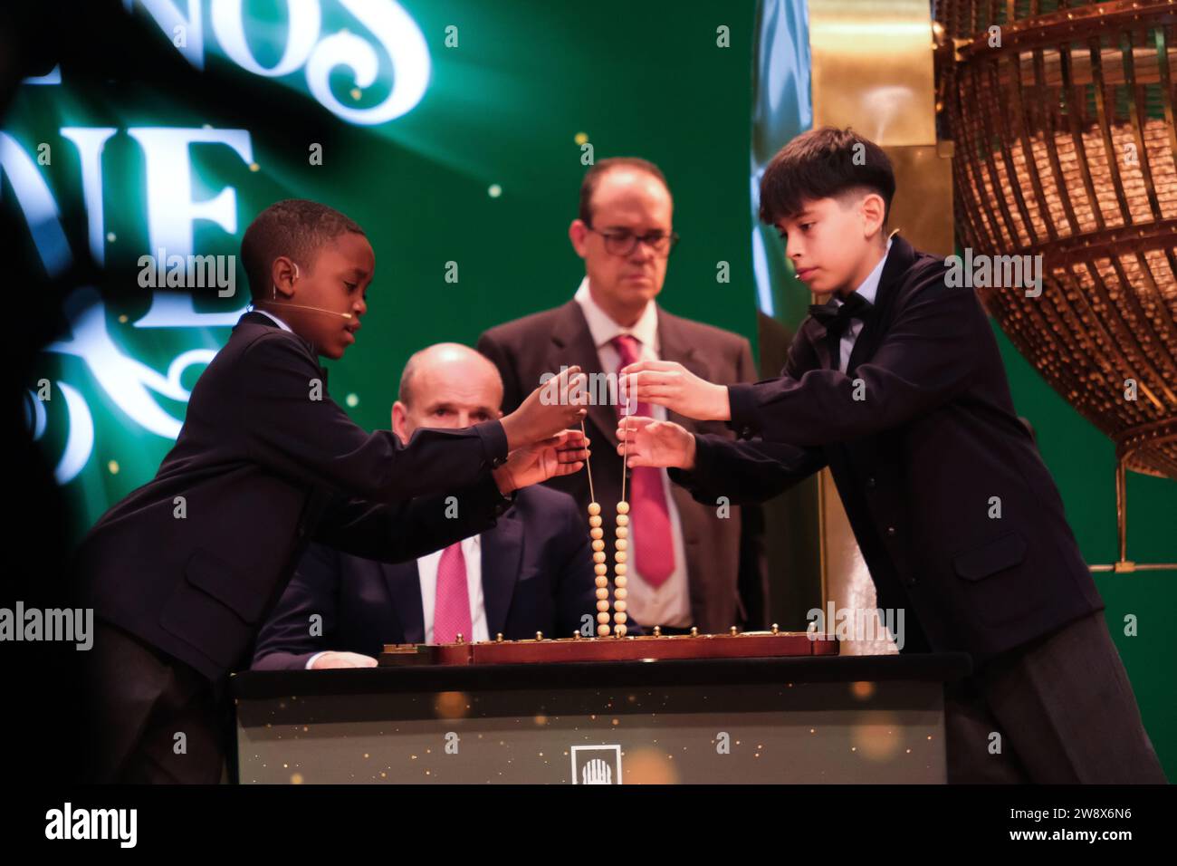The children of San Ildefonso sing the lottery balls with the numbers of the Extraordinary Draw of the Christmas Lottery, called 'El Gordo', at the Te Stock Photo