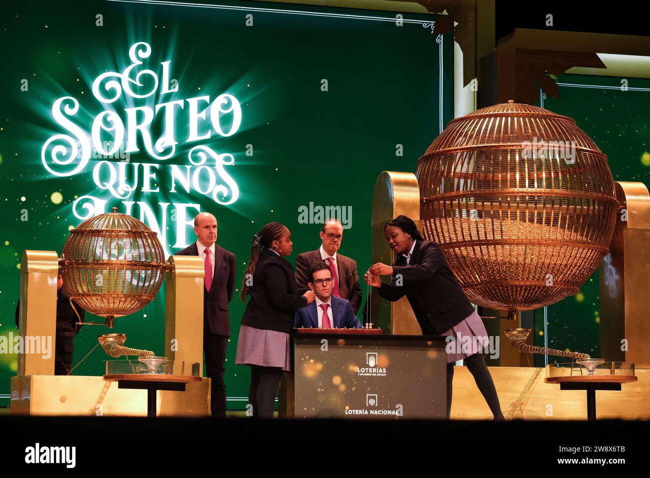 The children of San Ildefonso sing the lottery balls with the numbers of the Extraordinary Draw of the Christmas Lottery, called 'El Gordo', at the Te Stock Photo