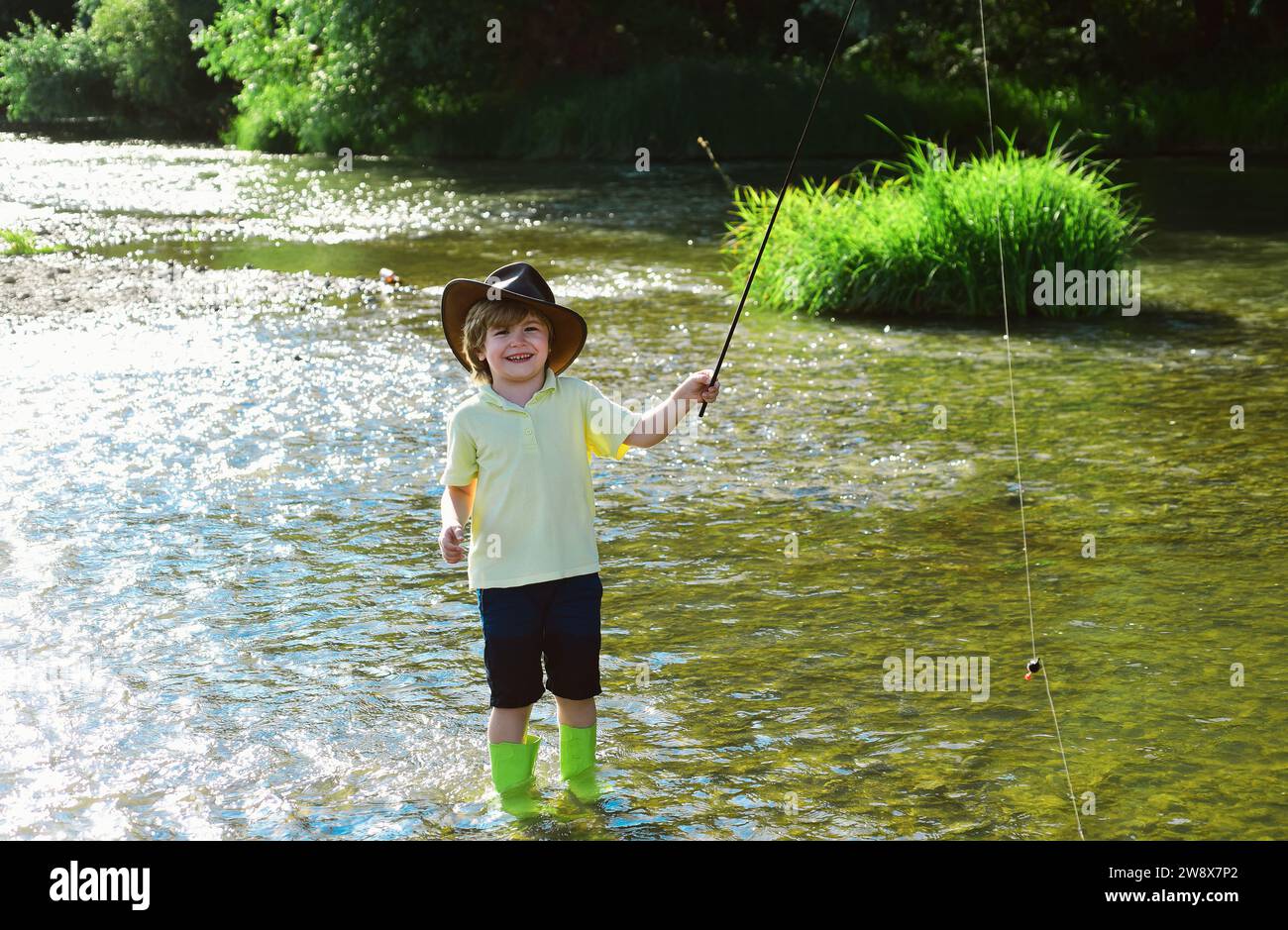 Cute boy fishing hi-res stock photography and images - Page 24 - Alamy