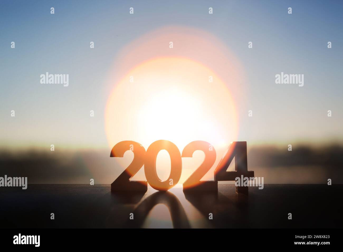 2024 New Year's morning sky, a brightly rising sun and a brilliant light sunrise that promises hope and wishes. Stock Photo
