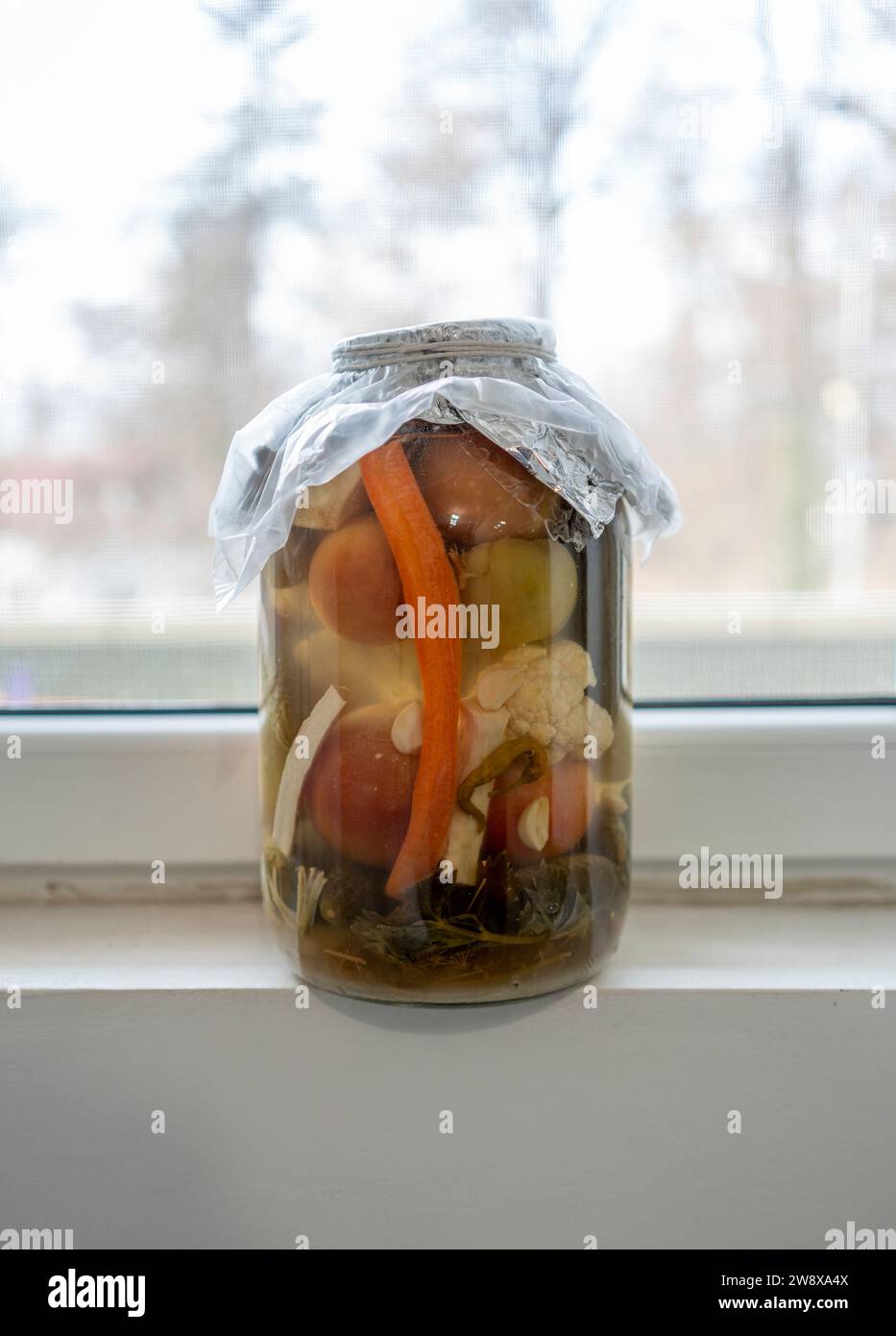 Big pickle jar next to window Stock Photo Alamy