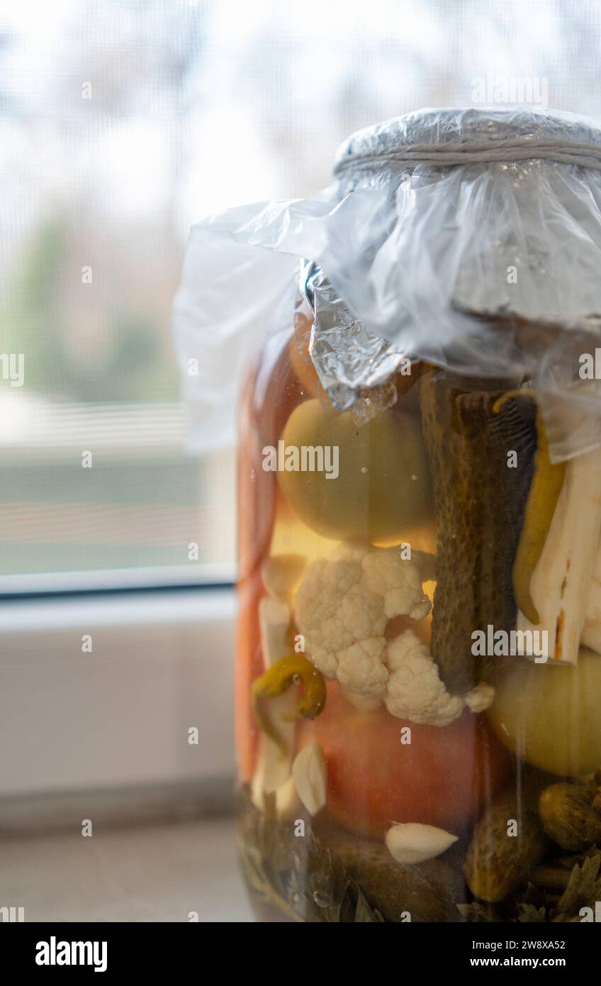 Big pickle jar next to window Stock Photo Alamy