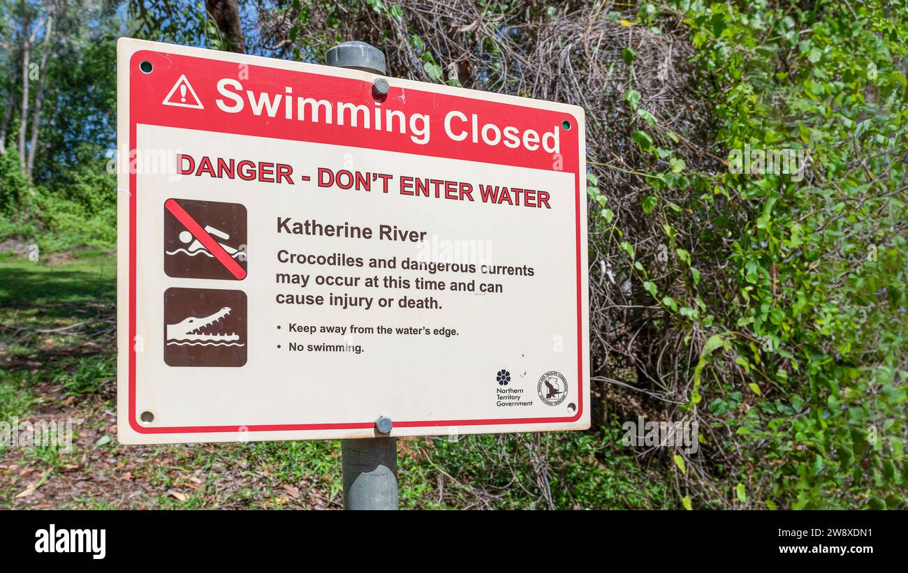 Danger crocodiles, no swimming - A warning sign located in the Northern Territory, Australia. Stock Photo