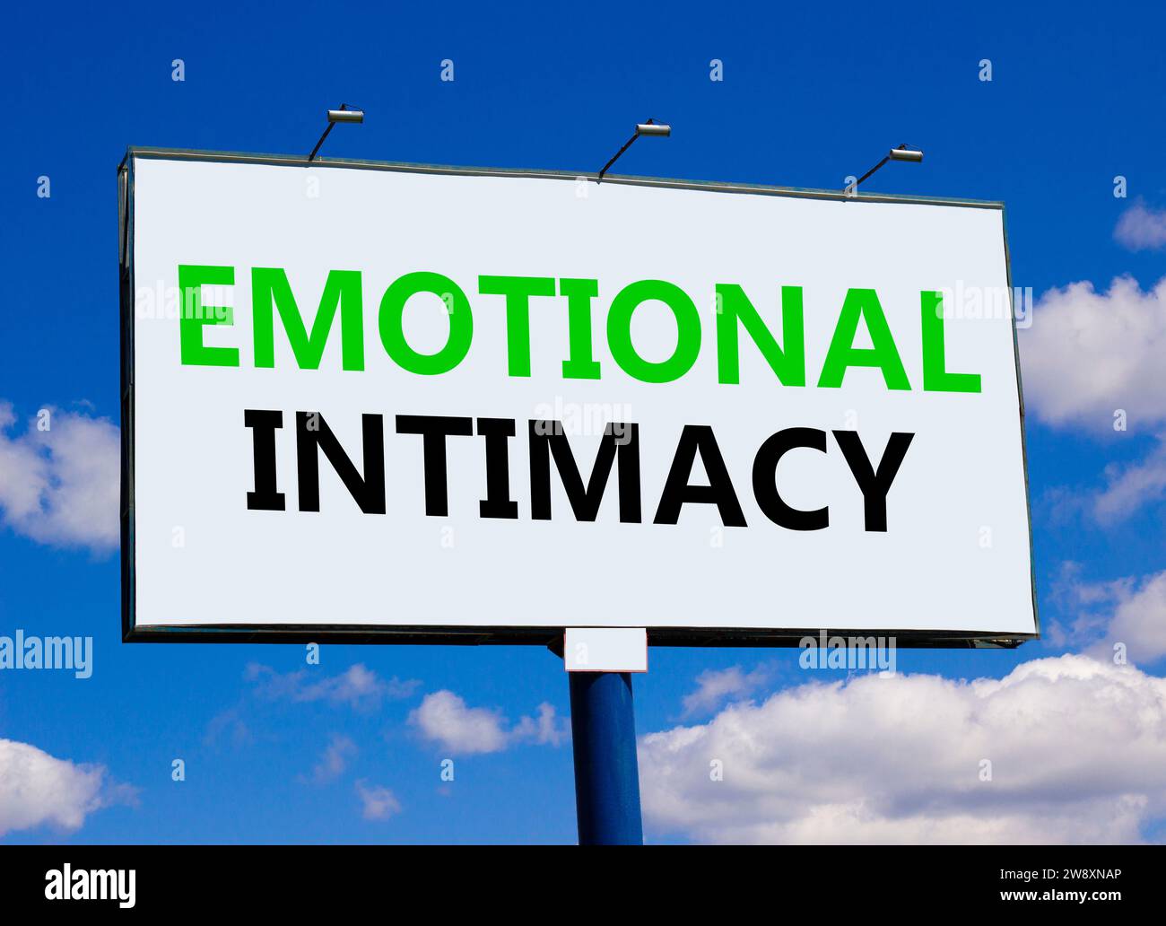 Emotional intimacy symbol. Concept words Emotional intimacy on beautiful white billboard. Beautiful blue sky white cloud background. Psychology emotio Stock Photo