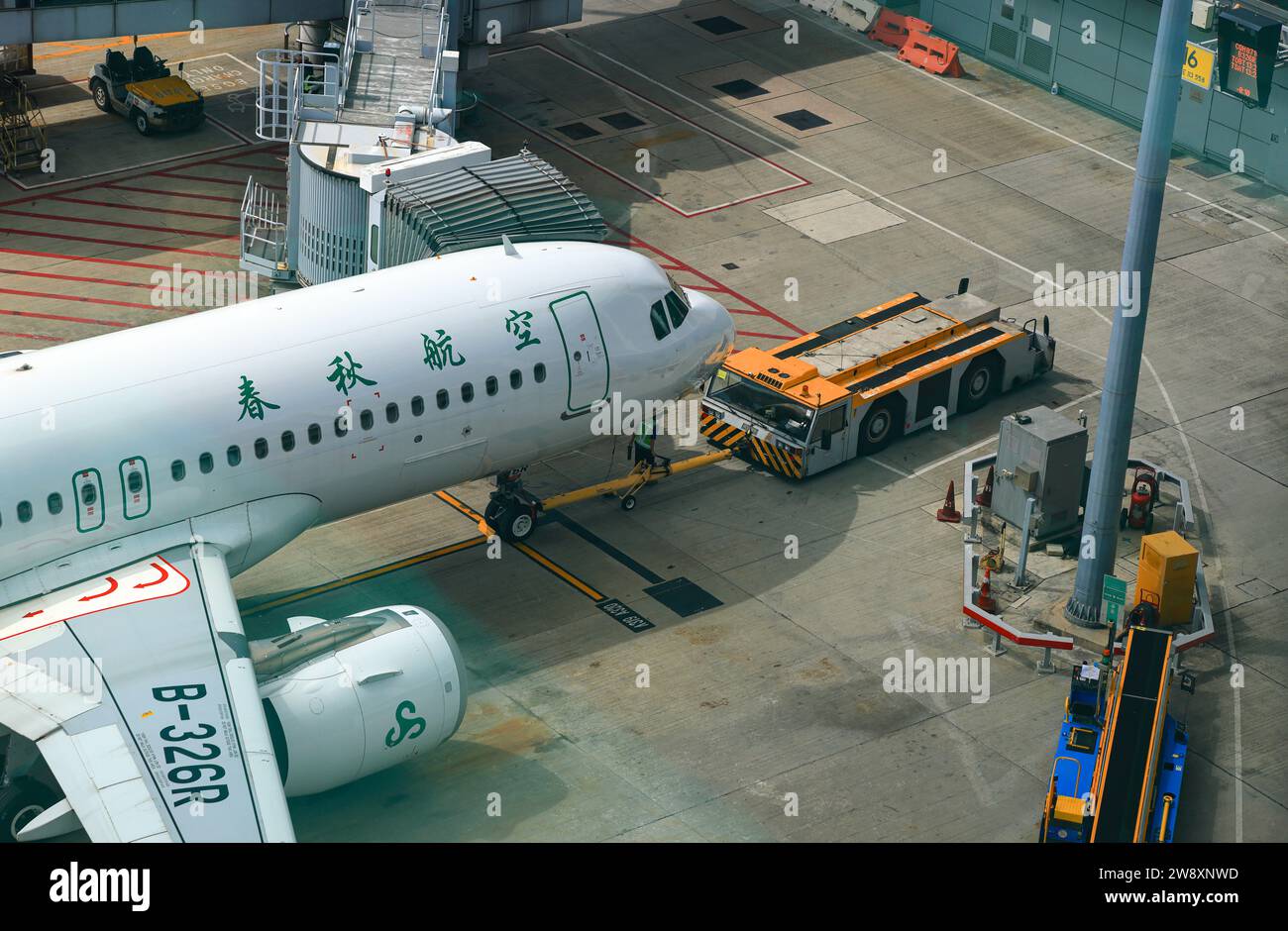 Airplane Tugs, Machine for push back the aircraft to taxiway in ground handling services at Hong Kong International Airport, Hong Kong. Stock Photo