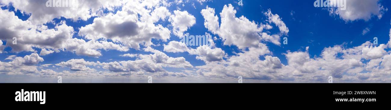 Panoramic view of blue sky with clouds and sunlight Stock Photo - Alamy