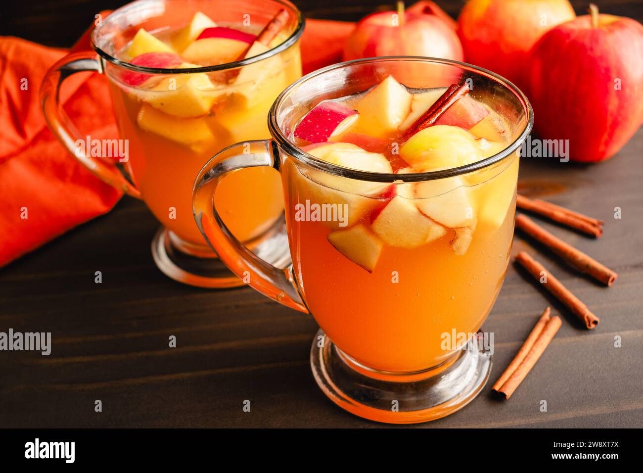 Fall Sangria Made with White Wine, Apples, Pears, and Cinnamon: Autumn sangria flavored with chunks of fruit, bourbon whiskey, and maple syrup Stock Photo