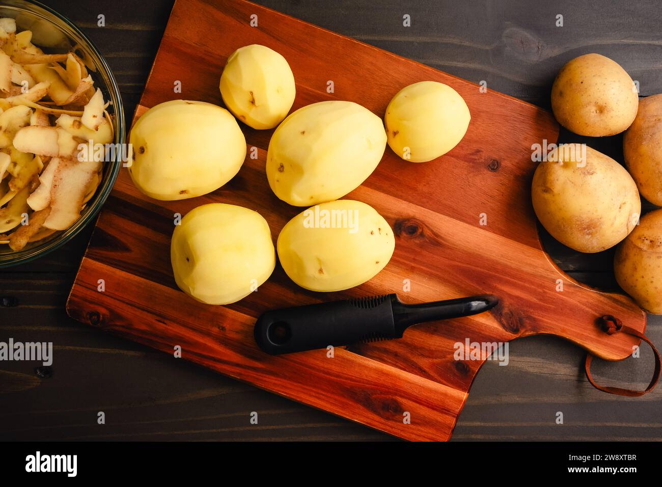 Peeled Yukon Gold Potatoes on a Wooden Cutting Board Peeled and