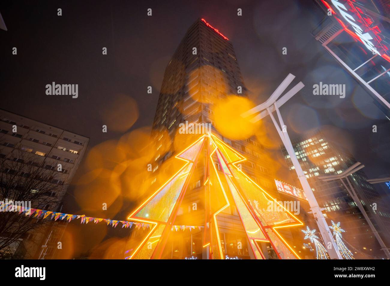 Warsaw, Poland. 22nd Dec, 2023. Colorful, illuminated Christmas lighting sculptures are seen in Warsaw, Poland on 22 December, 2023. Objects and designs from the time of the Polish People's Republic (PRL) have been chose as this year's theme for Christmas lighting decoratoins in the city. (Photo by Jaap Arriens/Sipa USA) Credit: Sipa USA/Alamy Live News Stock Photo