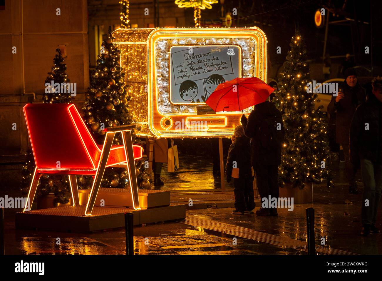 Warsaw, Poland. 22nd Dec, 2023. A vintage, cathode ray tube (CRT) television model, illuminated with Christmas lighting is seen playing Soviet era cartoons in Warsaw, Poland on 22 December, 2023. Objects and designs from the time of the Polish People's Republic (PRL) have been chose as this year's theme for Christmas lighting decoratoins in the city. (Photo by Jaap Arriens/Sipa USA) Credit: Sipa USA/Alamy Live News Stock Photo