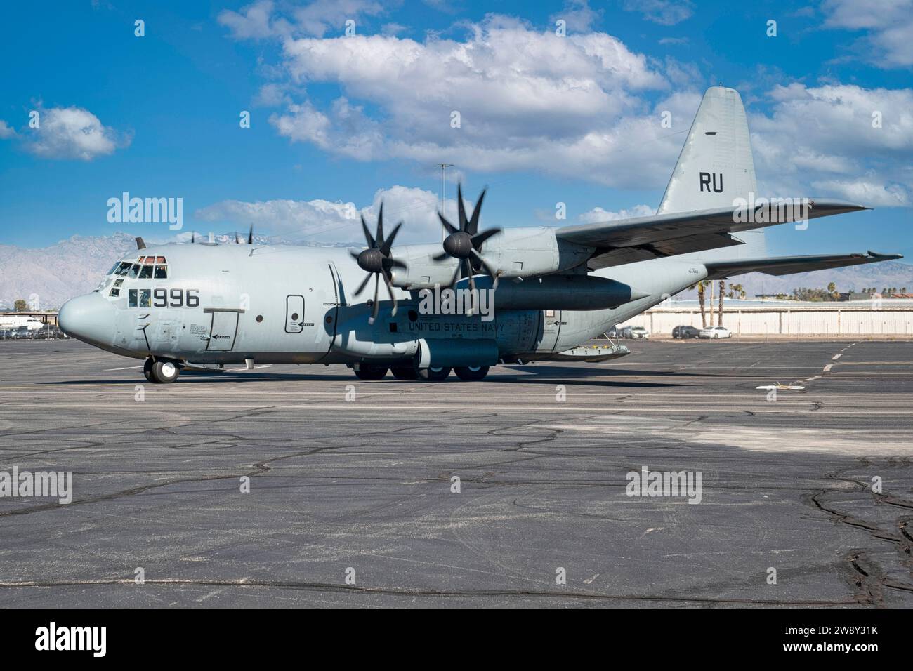 C130 of the US Navy taxiies past the Control Tower at Tucson