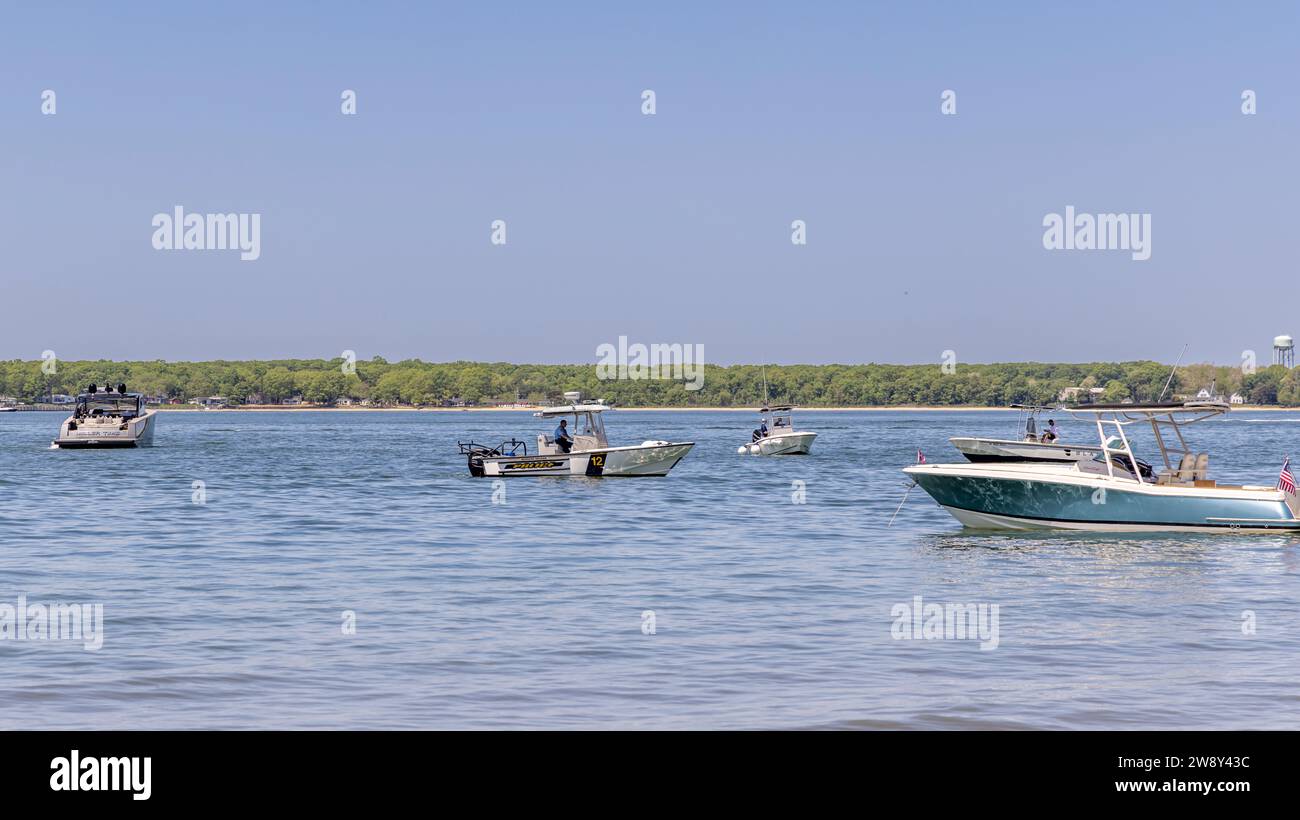 Shelter island, police boat cruising around anchored boats off crescent