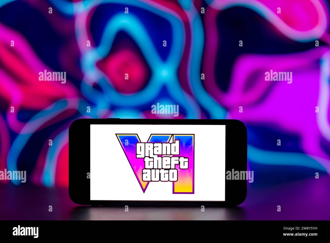 In this photo illustration, the Grand Theft Auto VI logo is seen displayed on a mobile phone screen. Stock Photo