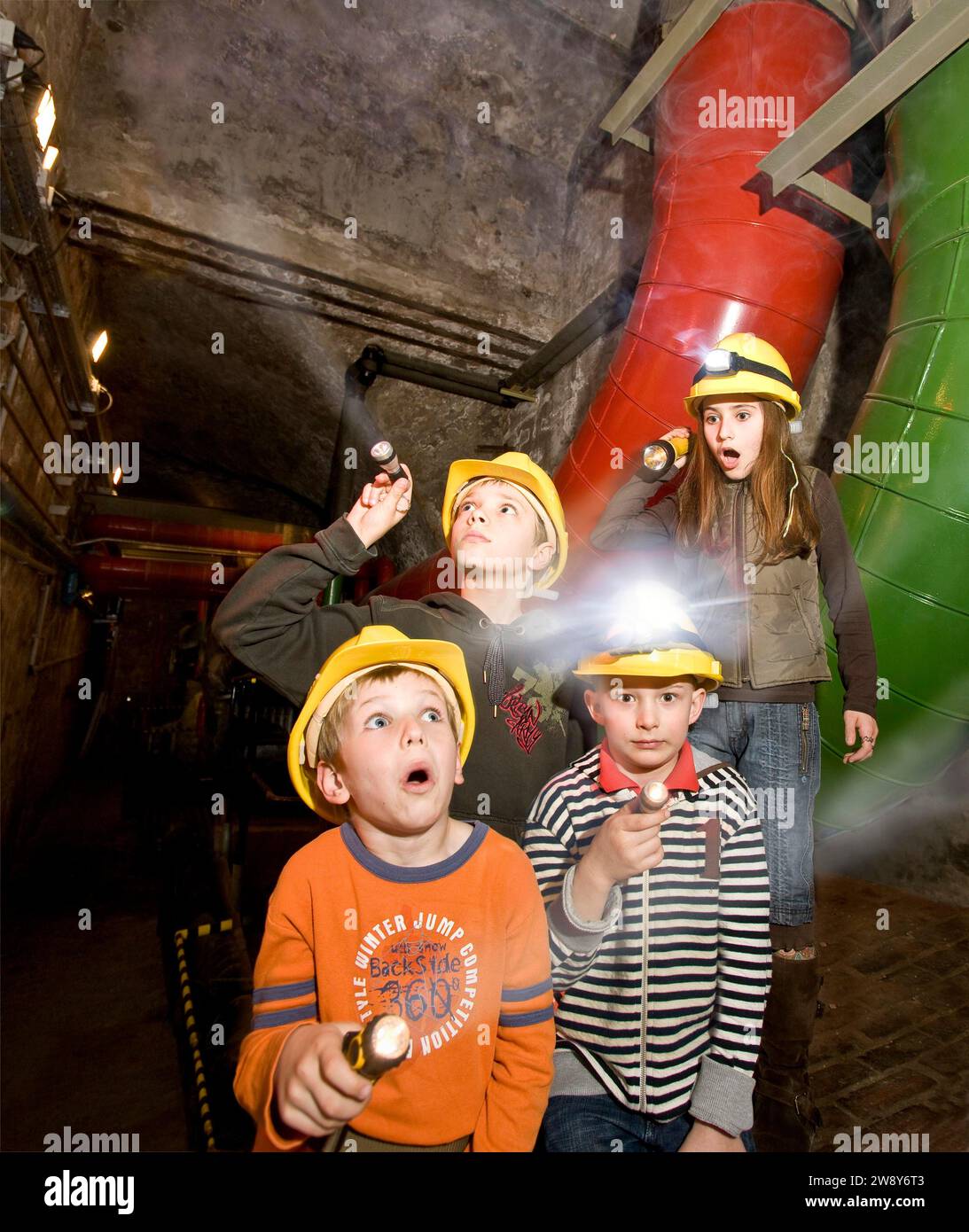Children on an expedition During the holidays, children like to go on adventurous expeditions on their own. Here is a gloomy boiler room Stock Photo