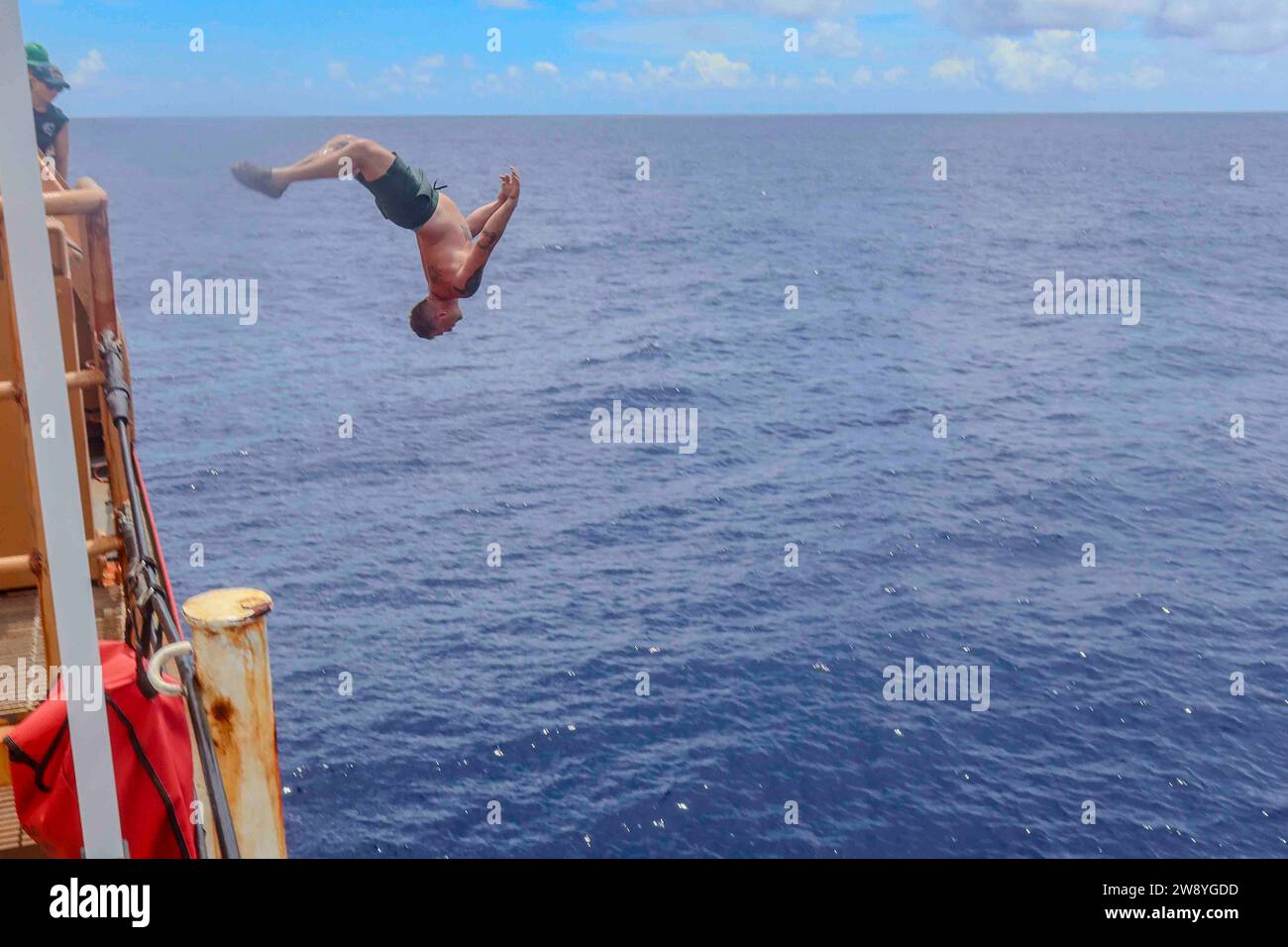 Pacific Ocean. 3rd Dec, 2023. Coast Guard Petty Officer 2nd Class Kody Young backflips into the Pacific Ocean, December. 3, 2023, during a swim cal (Credit Image: © U.S. Coast Guard/ZUMA Press Wire) EDITORIAL USAGE ONLY! Not for Commercial USAGE! Stock Photo