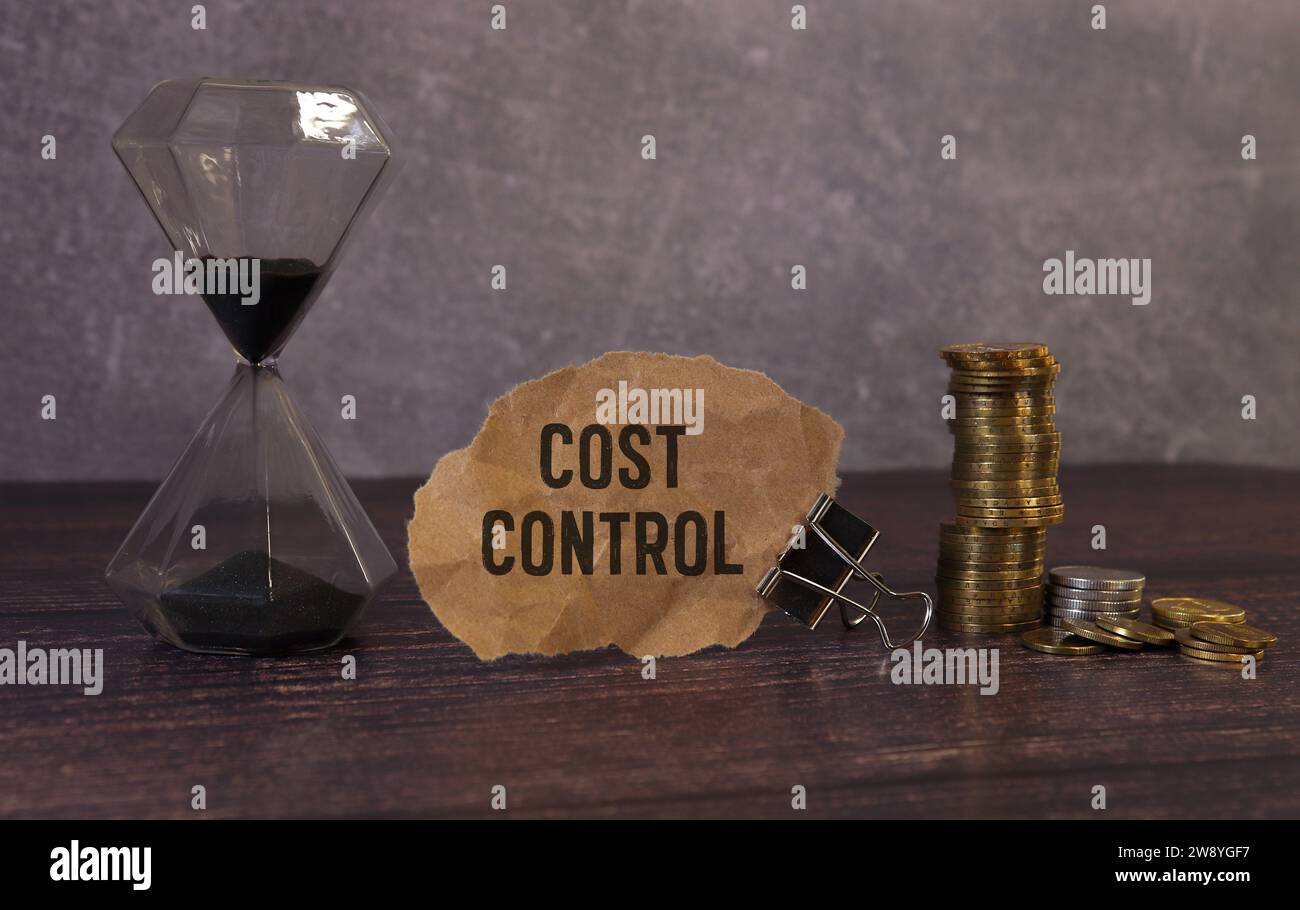 Cost Control Concept . torn paper from a notebook against the ...