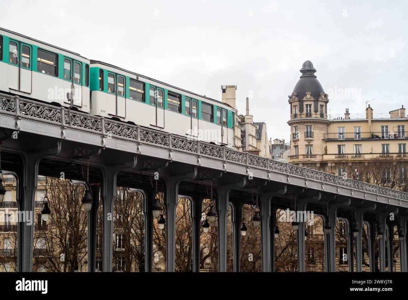 Metro line 6 on the Passy viaduct of the Bir Hakeim bridge in Paris - Paris Stock Photo