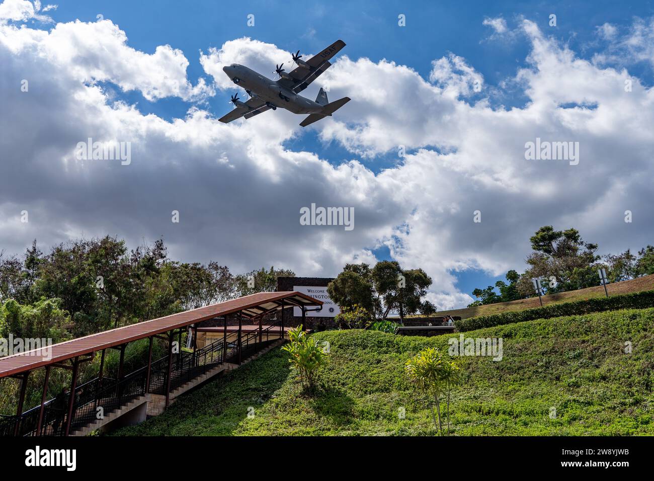 A U.S. Airforce fixedwing aircraft flies over the entrance to NSA/CSS