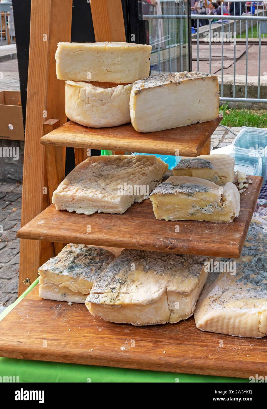 Traditional blue cheese dairy selection sold on market stall Stock