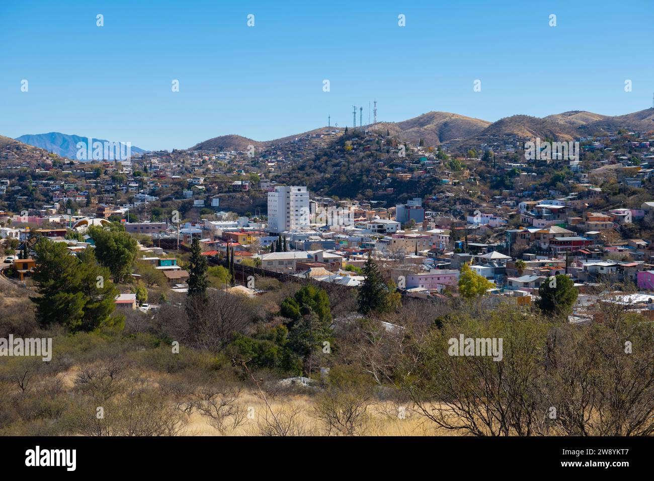 Aerial view of Nogales Sonora with Border Wall between Nogales Arizona USA and Nogales Sonora Mexico near International Street in city of Nogales, Ari Stock Photo