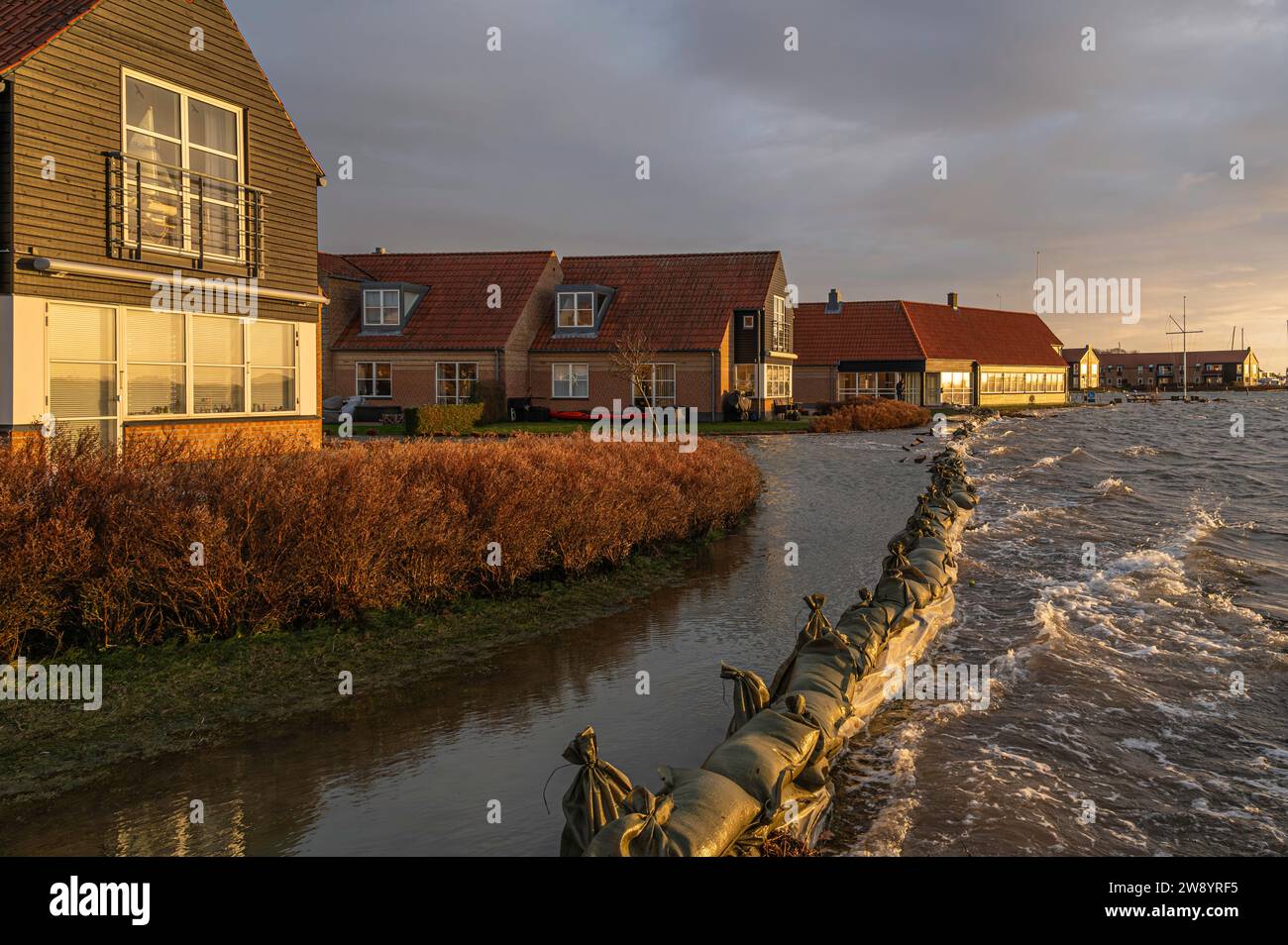 Sandbags protect against flooding in Frederikssund when the water level is at its highest on Friday afternoon, Denmark, Dec. 22, 2023 Stock Photo
