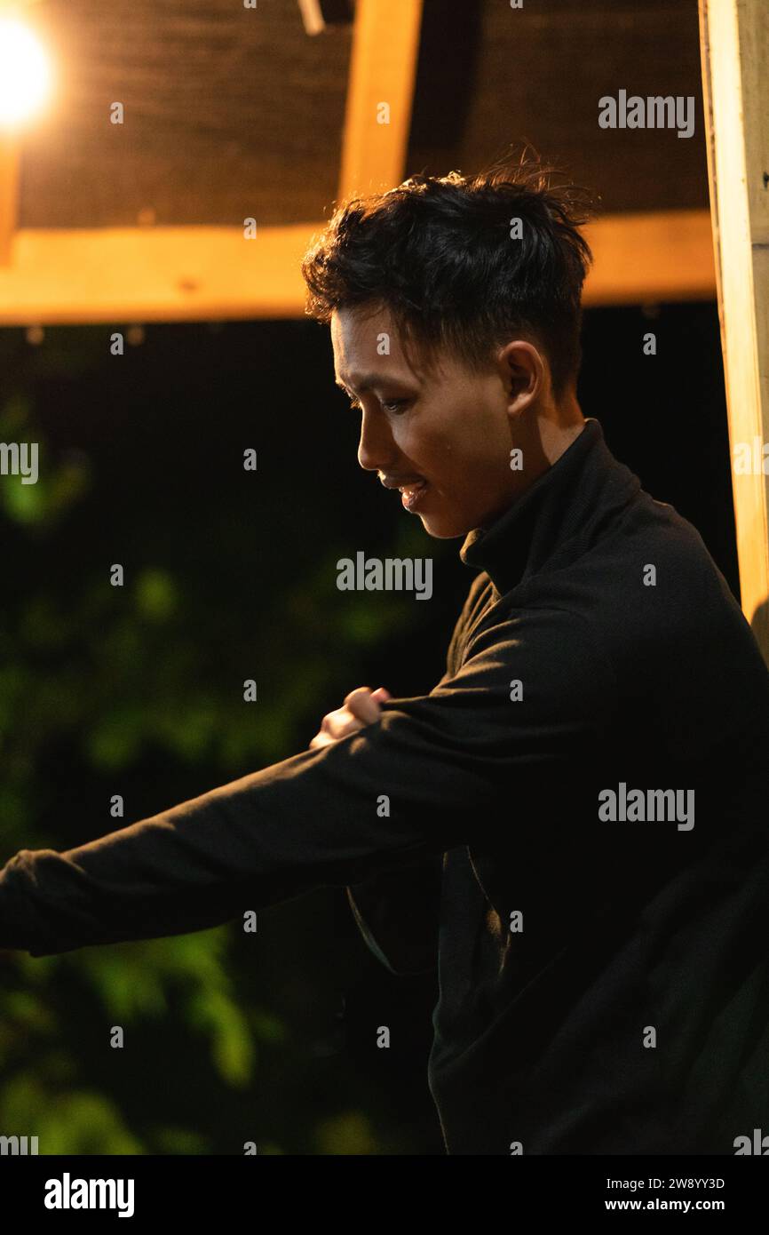 Asian men wearing casual black color clothes inside the wooden house in ...