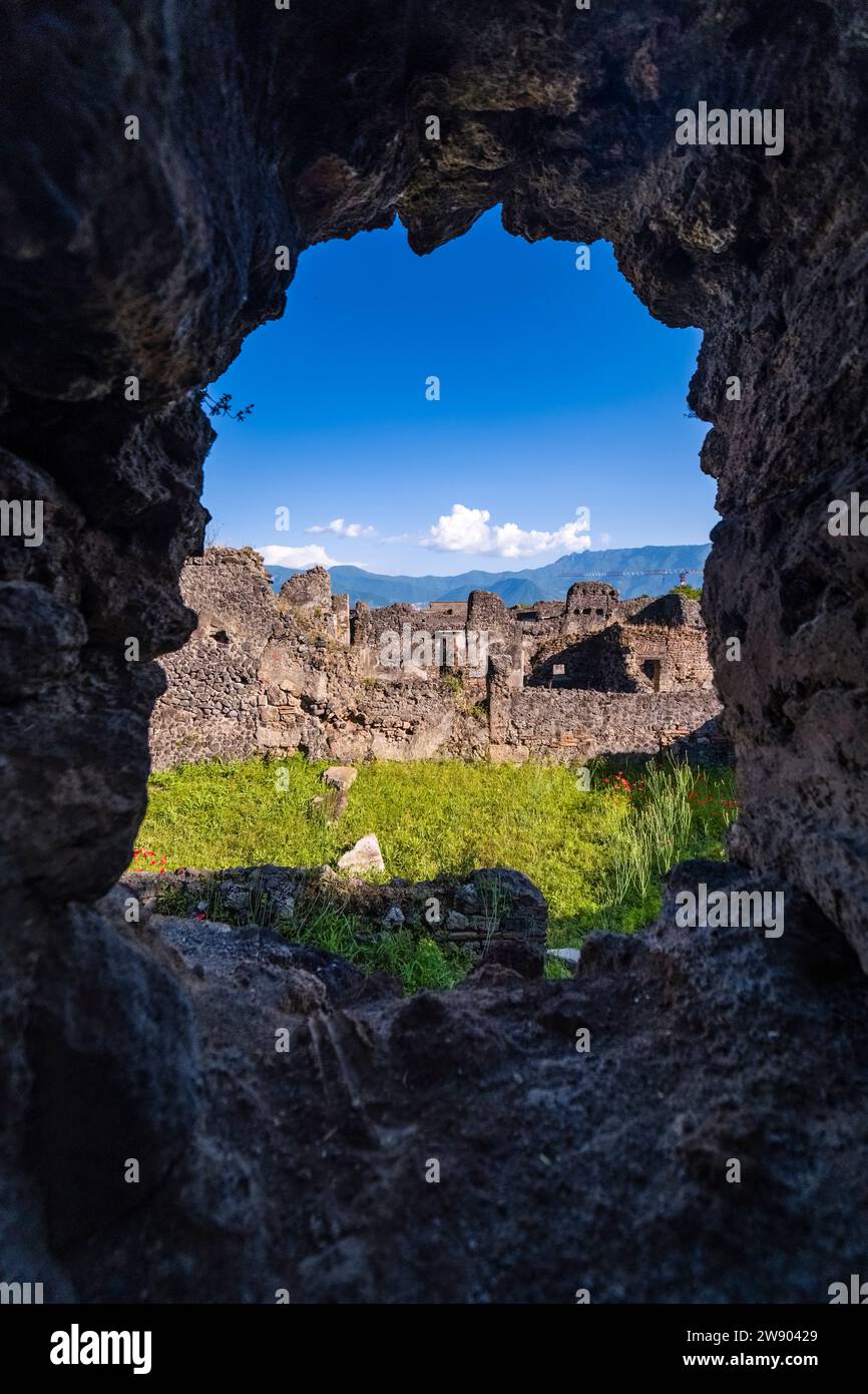 Ruins in Vicolo di Mercurio in the archaeological site of Pompeii, an ancient city destroyed by the eruption of Mount Vesuvius in 79 AD. Stock Photo